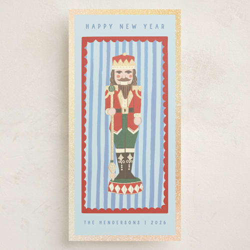 This is a frost foil pressed holiday cards with foil pressed by Teju Reval called gilded nutcracker printing on signature in tall