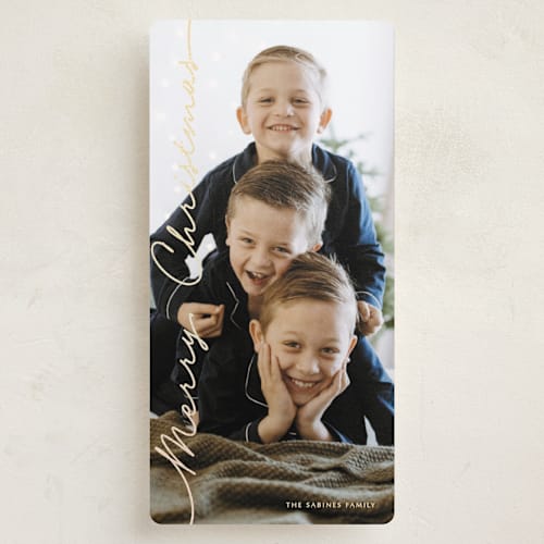 This is a golden glitz foil pressed holiday cards with foil pressed by Kaydi Bishop called side script printing on recycled smooth signature in tall