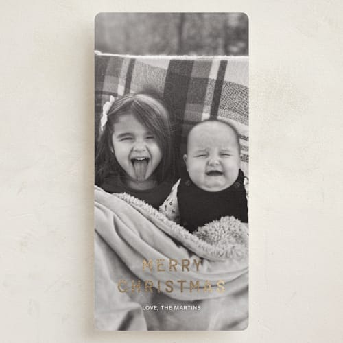 This is a snow foil pressed holiday cards with foil pressed by Ani Somi called just bold type printing on recycled smooth signature in tall