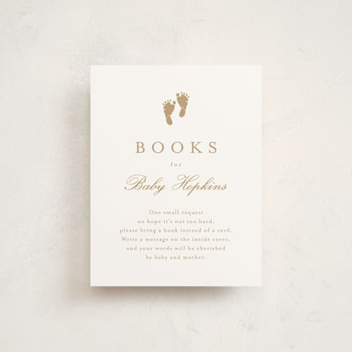 This is a golden baby shower insert cards with standard by Stacey Meacham called footprint printing on signature in standard