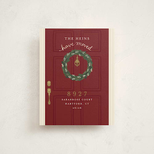 This is a deep red moving announcements with standard by Emily Hein called door wreath printing on signature in standard