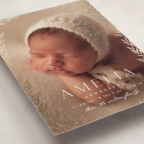 This is a vanilla foil stamped birth announcements with foil pressed by Laura Hankins called botanica frame printing on smooth signature in standard