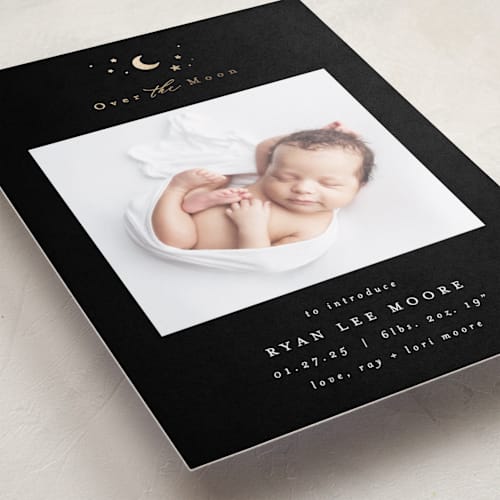 This is a noir foil stamped birth announcements with foil pressed by AK Graphics called over the moon printing on smooth signature in standard