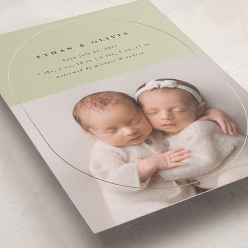 This is a sage foil stamped birth announcements with foil pressed by Stacy Maalouf called oval announcement printing on recycled smooth signature in standard