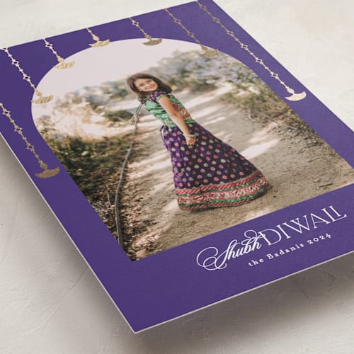 This is a aubergine diwali cards with foil pressed by Creo Study called diwali toran printing on recycled smooth signature in standard