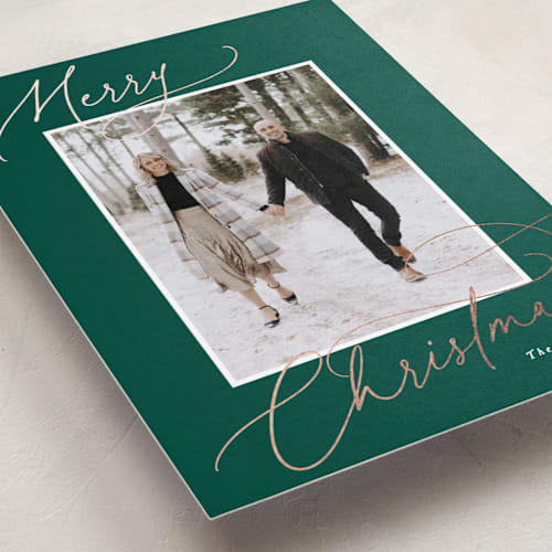 This is a pine foil pressed holiday cards with foil pressed by Hooray Creative called christmas script printing on recycled smooth signature in standard