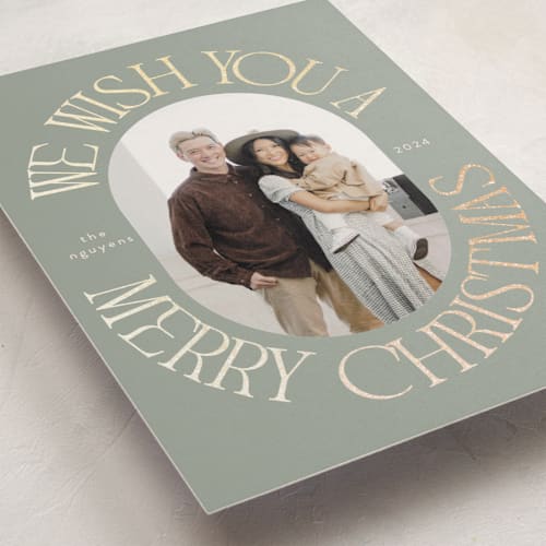 This is a seaglass foil pressed holiday cards with foil pressed by Morgan Kendall called merry wish printing on recycled smooth signature in standard