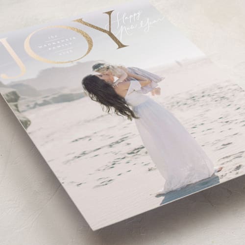 This is a mist foil pressed holiday cards with foil pressed by Wildfield Paper Co called joy to all the world printing on recycled smooth signature in standard