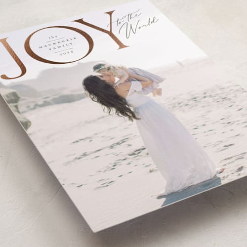 This is a pine foil pressed holiday cards with foil pressed by Wildfield Paper Co called joy to all the world printing on recycled smooth signature in standard