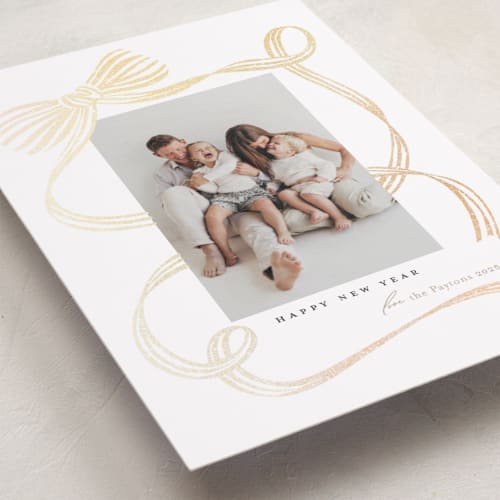 This is a tan foil pressed holiday cards with foil pressed by Carrie ONeal called neddy printing on recycled smooth signature in standard
