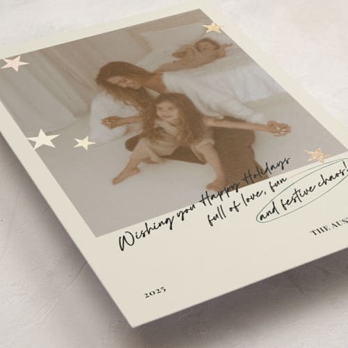 This is a buttercream foil pressed holiday cards with foil pressed by Helena Vitto called messy christmas printing on recycled smooth signature in standard