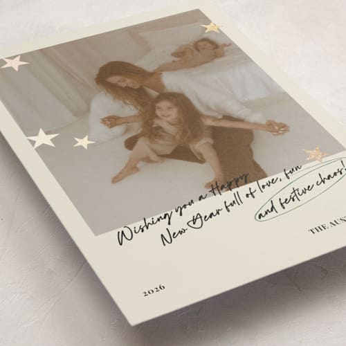 This is a buttercream foil pressed holiday cards with foil pressed by Helena Vitto called messy christmas printing on recycled smooth signature in standard