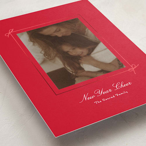 This is a poinsettia foil pressed holiday cards with foil pressed by Baumbirdy called delicate bow printing on recycled smooth signature in standard