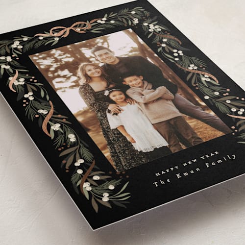 This is a charcoal foil pressed holiday cards with foil pressed by Leah Bisch called greenery garland printing on recycled smooth signature in standard
