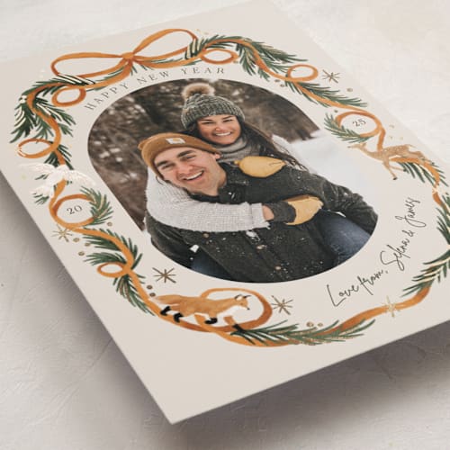 This is a cinnamon foil pressed holiday cards with foil pressed by Elly called winter ribbon printing on recycled smooth signature in standard