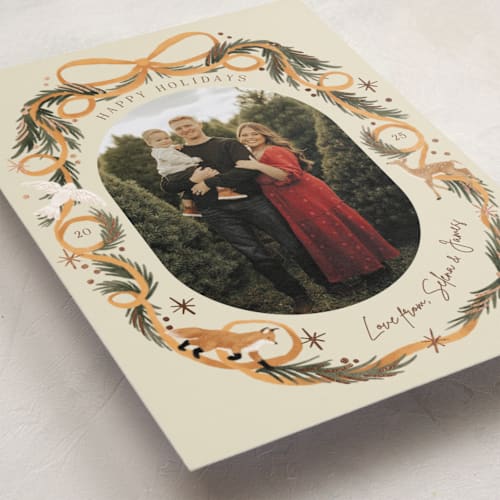This is a sunset foil pressed holiday cards with foil pressed by Elly called winter ribbon printing on recycled smooth signature in standard