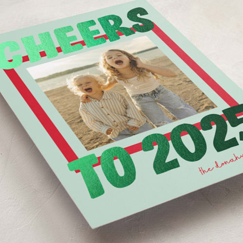 This is a wintermint foil pressed holiday cards with foil pressed by Shari Margolin called bold and bright printing on recycled smooth signature in standard
