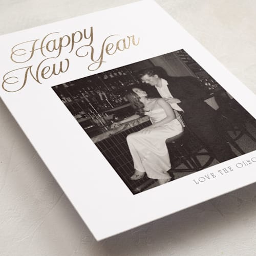 This is a snow foil pressed holiday cards with foil pressed by Nicole Walsh called happy script printing on recycled smooth signature in standard