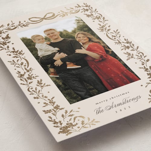 This is a buttercream foil pressed holiday cards with foil pressed by Kate Ahn called glittering garland printing on recycled smooth signature in standard