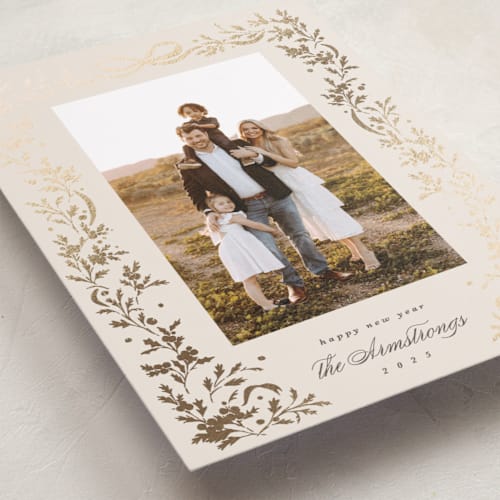 This is a buttercream foil pressed holiday cards with foil pressed by Kate Ahn called glittering garland printing on recycled smooth signature in standard