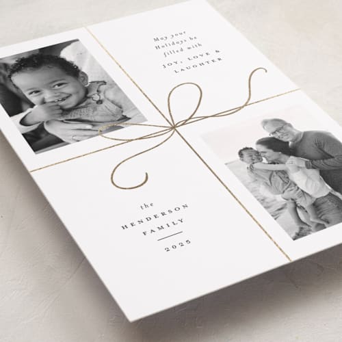This is a snow foil pressed holiday cards with foil pressed by Emily Betts called bow two printing on recycled smooth signature in standard