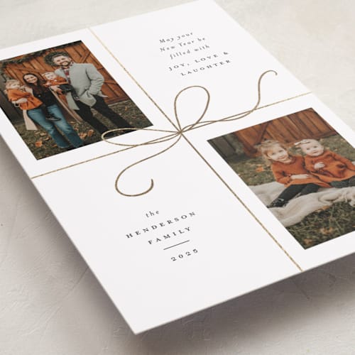 This is a snow foil pressed holiday cards with foil pressed by Emily Betts called bow two printing on recycled smooth signature in standard