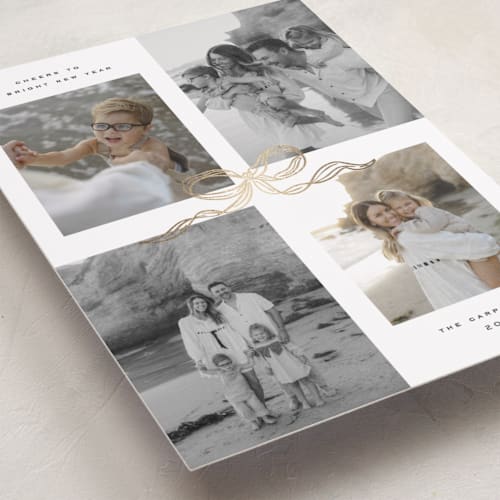 This is a vanilla foil pressed holiday cards with foil pressed by Creo Study called shimmering bow tie printing on recycled smooth signature in standard