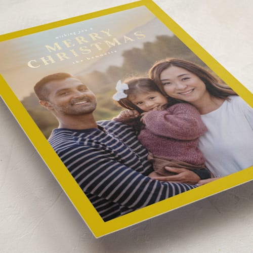 This is a mustard foil pressed holiday cards with foil pressed by Chris Griffith called a sentimental holiday printing on recycled smooth signature in standard