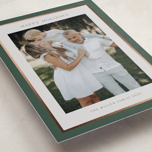 This is a evergreen foil pressed holiday cards with foil pressed by Nicole Walsh called foil frame printing on recycled smooth signature in standard