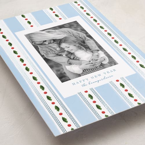 This is a robin's egg foil pressed holiday cards with foil pressed by Baumbirdy called holly frames printing on recycled smooth signature in standard