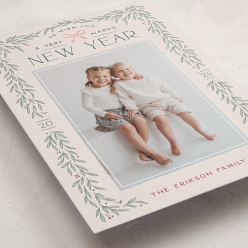 This is a ecru foil pressed holiday cards with foil pressed by Hooray Creative called christmas garland printing on recycled smooth signature in standard