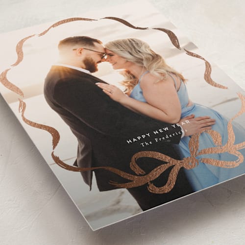 This is a mist foil pressed holiday cards with foil pressed by Jackie Crawford called rustic bow printing on recycled smooth signature in standard