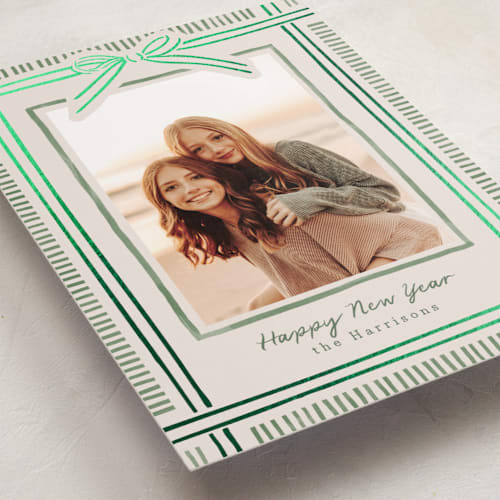 This is a moss foil pressed holiday cards with foil pressed by Chris Griffith called holiday wrap printing on recycled smooth signature in standard