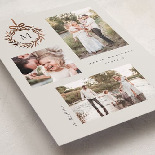 This is a vanilla foil pressed holiday cards with foil pressed by Melanie Kosuge called monogram trio printing on recycled smooth signature in standard