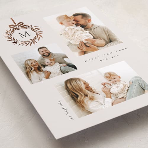 This is a vanilla foil pressed holiday cards with foil pressed by Melanie Kosuge called monogram trio printing on recycled smooth signature in standard