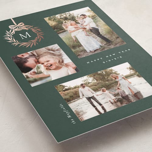 This is a evergreen foil pressed holiday cards with foil pressed by Melanie Kosuge called monogram trio printing on recycled smooth signature in standard