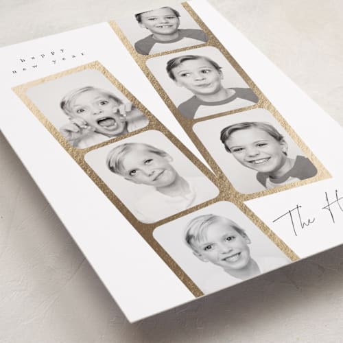 This is a snowfall foil pressed holiday cards with foil pressed by Leah Bisch called snapshots printing on recycled smooth signature in standard
