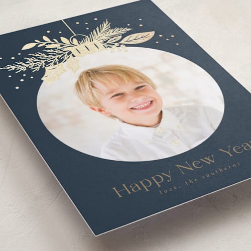 This is a night foil pressed holiday cards with foil pressed by Erin German called ornament greenery printing on recycled smooth signature in standard