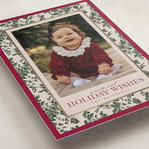 This is a holly berry foil pressed holiday cards with foil pressed by Jenna Holcomb called merry floral toile printing on recycled smooth signature in standard