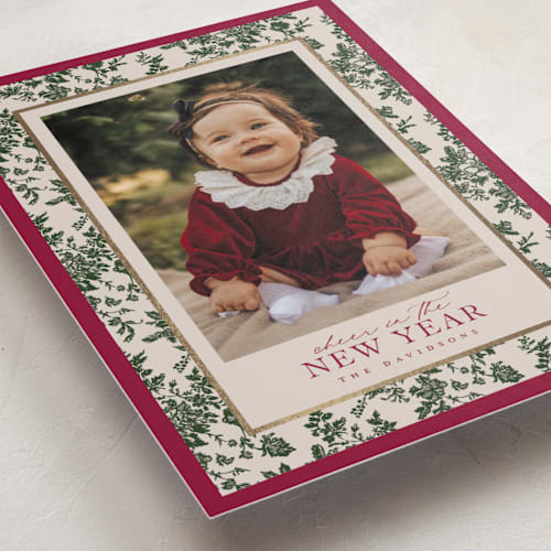 This is a holly berry foil pressed holiday cards with foil pressed by Jenna Holcomb called merry floral toile printing on recycled smooth signature in standard
