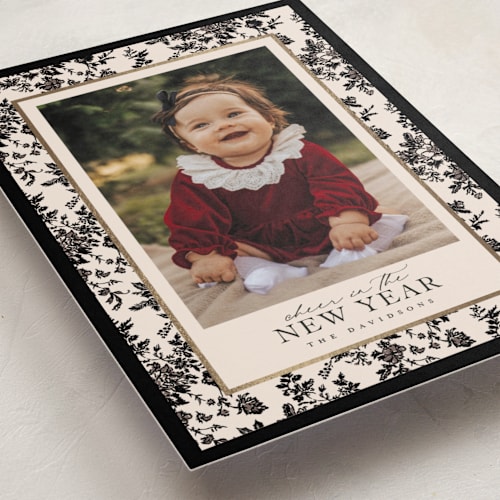 This is a coal foil pressed holiday cards with foil pressed by Jenna Holcomb called merry floral toile printing on recycled smooth signature in standard