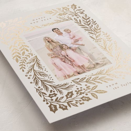 This is a buttercream foil pressed holiday cards with foil pressed by Alethea and Ruth called gilded forest printing on recycled smooth signature in standard
