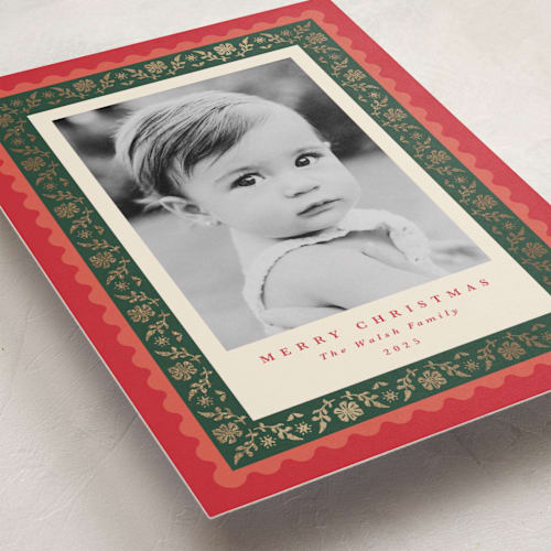 This is a holly berry foil pressed holiday cards with foil pressed by Olivia Raufman called folkloric printing on recycled smooth signature in standard