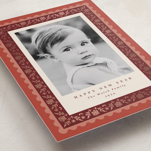 This is a cinnamon foil pressed holiday cards with foil pressed by Olivia Raufman called folkloric printing on recycled smooth signature in standard