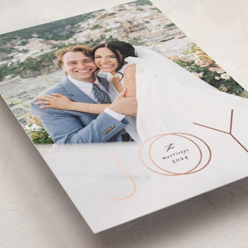 This is a midnight foil pressed holiday cards with foil pressed by Erica Krystek called rings of joy printing on recycled smooth signature in standard