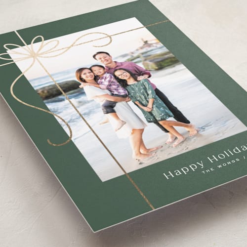 This is a emerald foil pressed holiday cards with foil pressed by Michelle Taylor called gilded ribbon printing on recycled smooth signature in standard