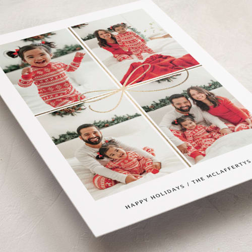 This is a snow foil pressed holiday cards with foil pressed by Laura Bercovich called all wrapped up printing on recycled smooth signature in standard