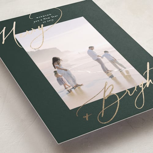 This is a evergreen foil pressed holiday cards with foil pressed by Carolyn Nicks called bright+merry printing on recycled smooth signature in standard