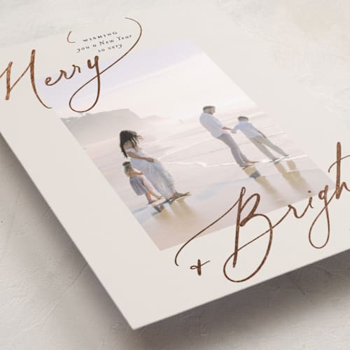 This is a sweet cream foil pressed holiday cards with foil pressed by Carolyn Nicks called bright+merry printing on recycled smooth signature in standard