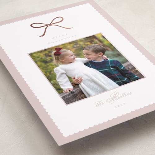 This is a winter rose foil pressed holiday cards with foil pressed by Emily Betts called scallop bow printing on recycled smooth signature in standard
